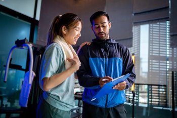 Trainer helping student athlete