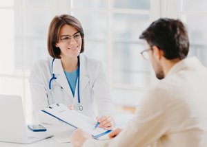 Doctor with young male patient