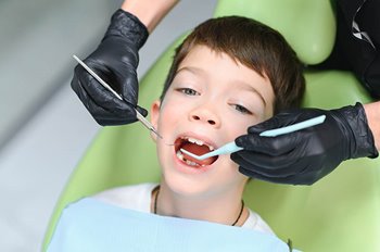 Child getting teeth cleaned