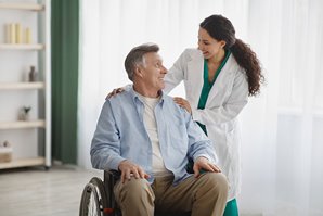Nurse Helping Patient in Wheelchair