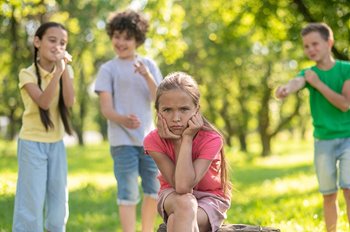 Children bullying young girl