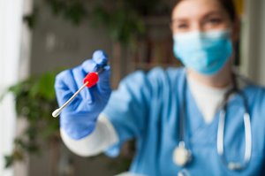 Doctor or nurse with Covid test