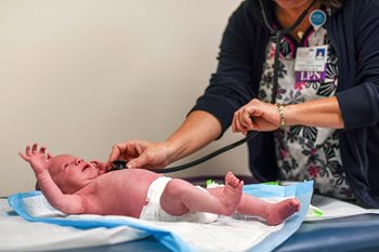 Nurse checking baby heartbeat