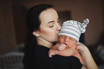 Mother holding newborn baby