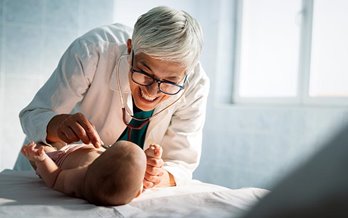 Doctor checking baby's heartbeat